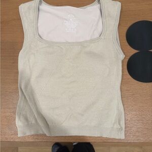 A pair of Klassy tank tops with built in bras and extra cups.